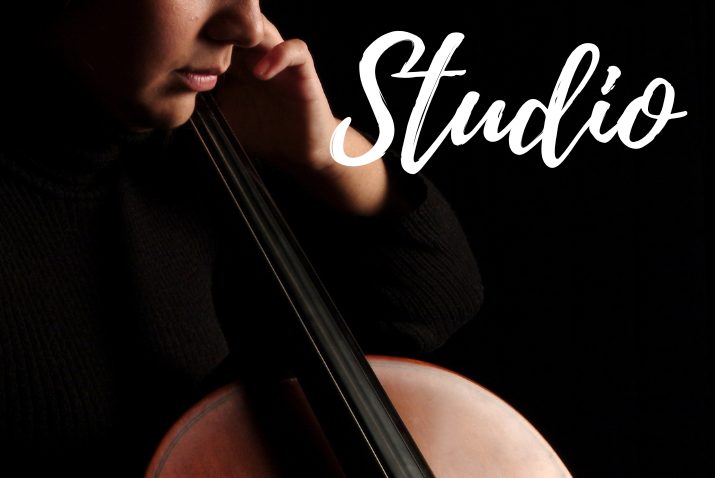 Person holding a cello with 'Studio' text overlay